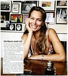 danish mom Aug. 2004 -inside with many photos on the wall behind