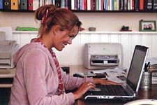 danish Sondag 16. Aug. 2004 - inside, hair up, sitting behind the laptop